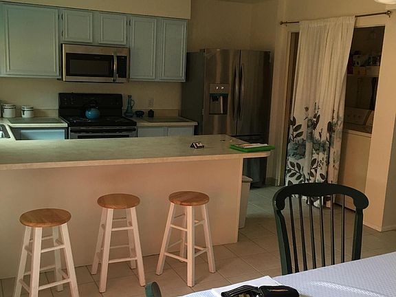 Kitchen with washer/dryer.