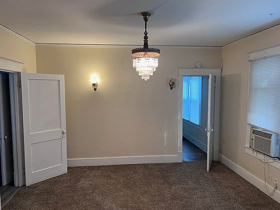 Dining room off Living Room. Door to right leads to bedroom. Door to left leads to kitchen.