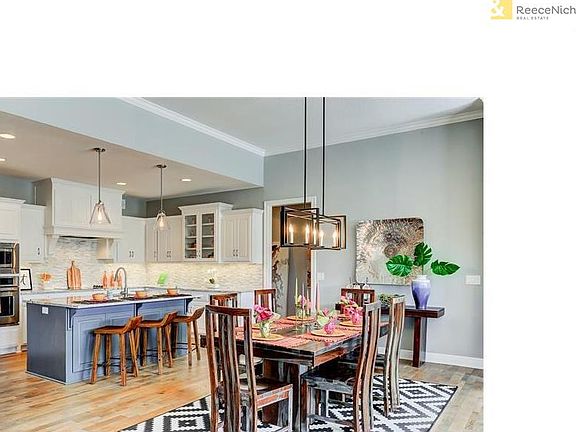 Spacious kitchen boasts generous amount of cabinets, counter space and a wonderful island.