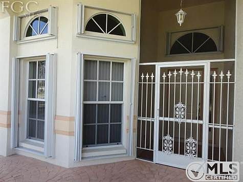 Home protected with Accordion Hurricane Shutters.  Screened Entry for cross breeze.