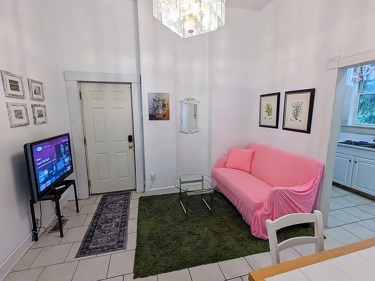 Walk in to The Apartment at 1816 and you will find your living area with the kitchen on the left and the hall to bedrooms straight ahead.