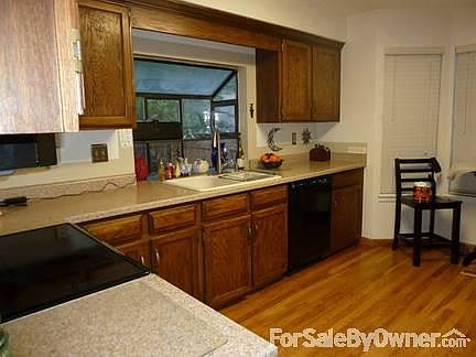 Lots of cabinets with breakfast nook