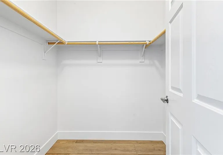 Walking in closet for primary bedroom
