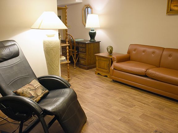 Reclining massage chair with optional heat