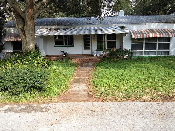 Street view of front door and porch.
