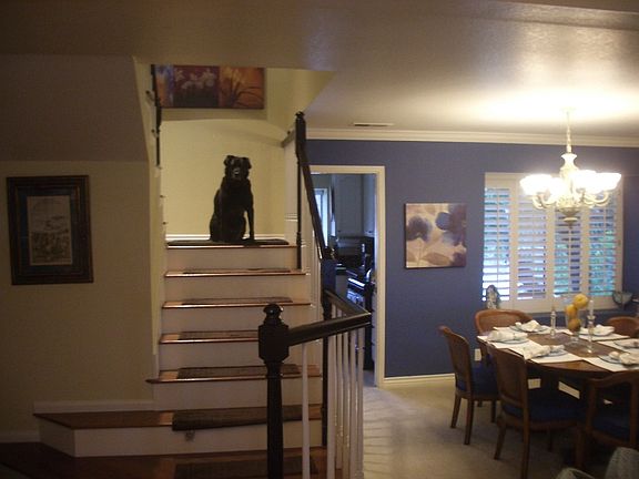Stairway, and dining room to right