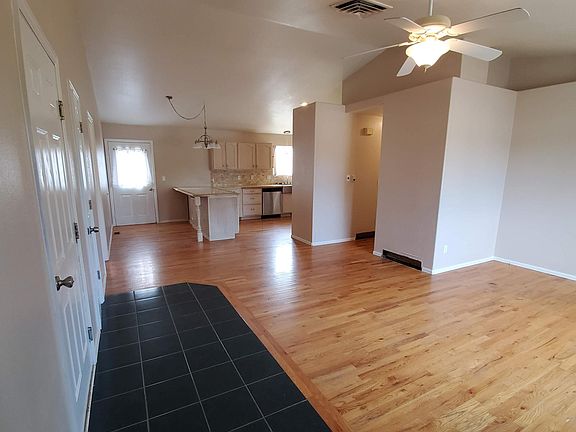 View into the central, open-concept living space from the front door