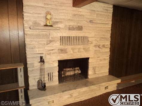 Beautiful wood fireplace in the basement family room.