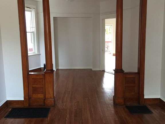 Interior view facing toward sunny back porch and kitchen.