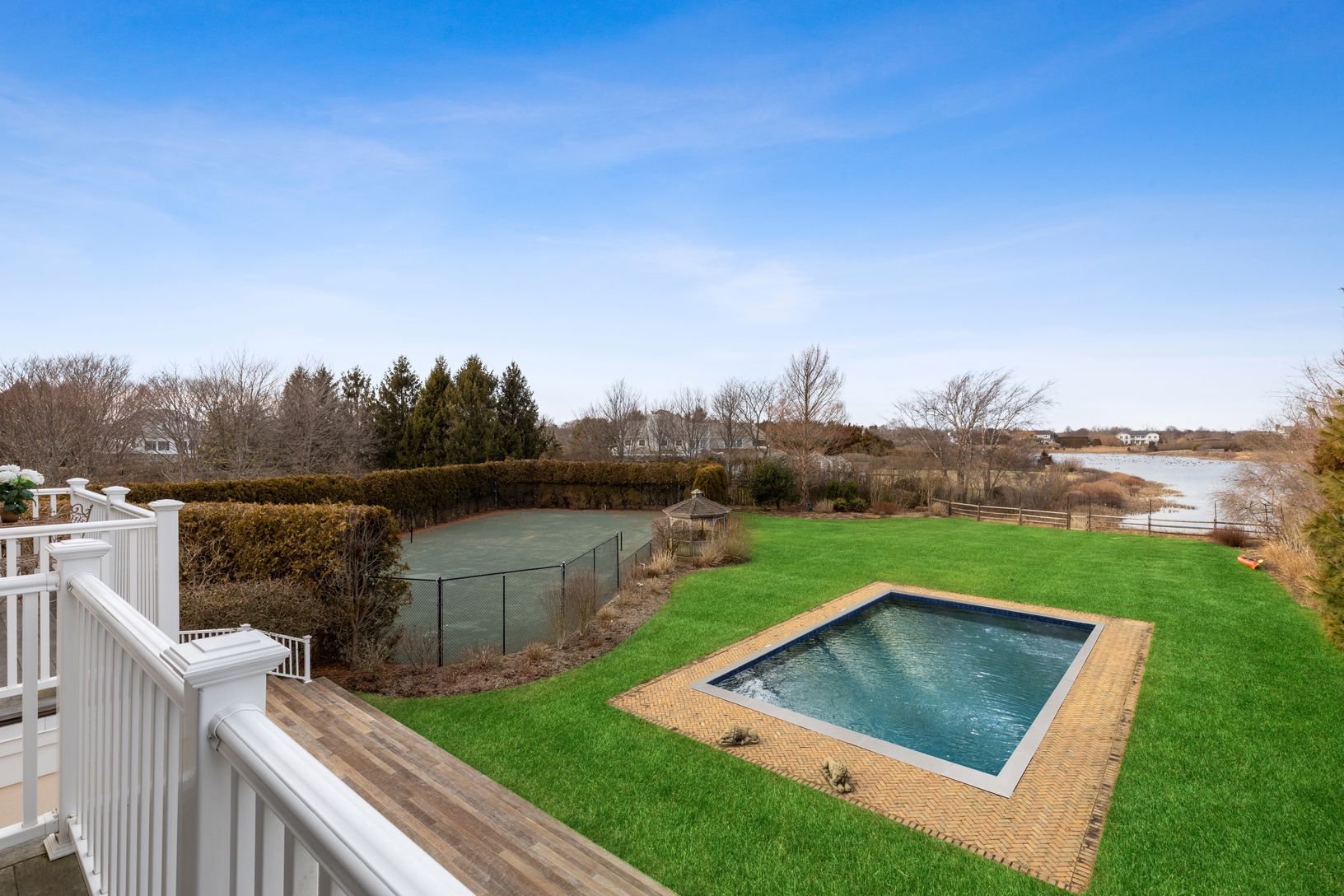 True North / South Har-Tru Tennis Court & Gunite Pool within Magnificently Landscape property