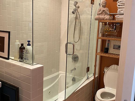 Shower over tub in second bedroom suite