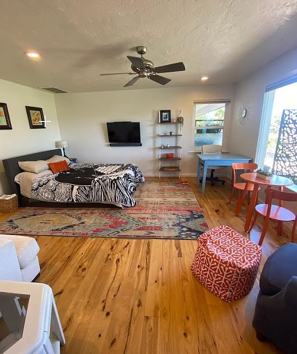 Large living space with massive window to let in the sun and show off the incredible view