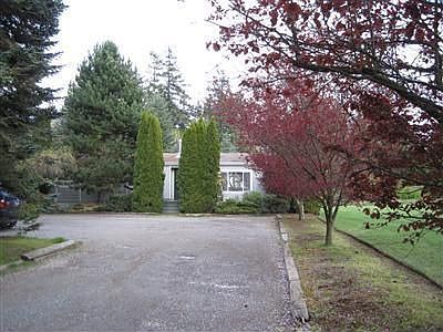 Set back from the road with large parking area