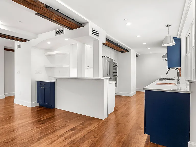 Kitchen with Wrap around seating island and coffee bar