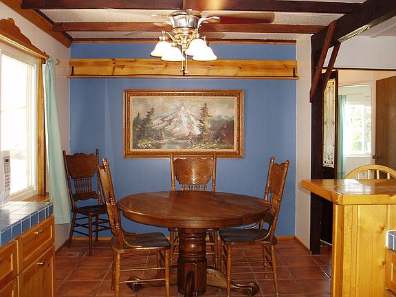 Dining Area w/ wood beam ceiling and new fan/light