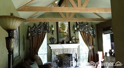 Family room w/ beamed cathedral ceilings