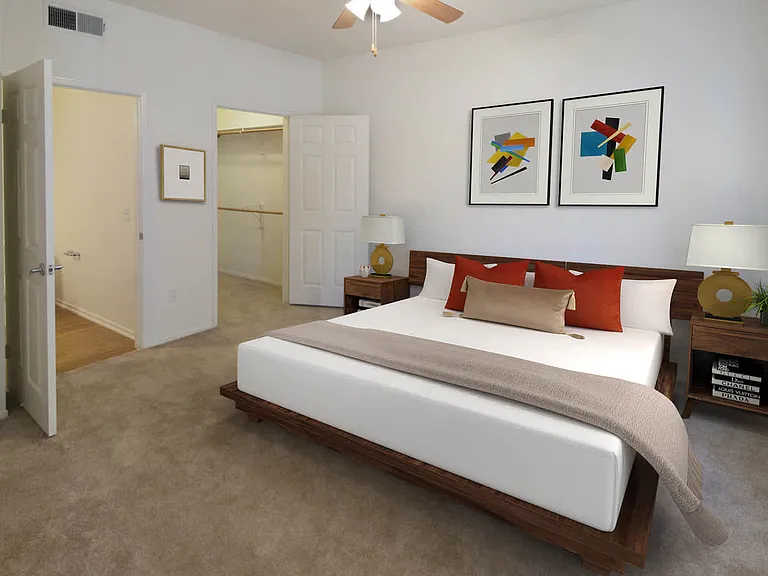 Carpeted Bedroom with Walk-In Closet and En Suite Bathroom