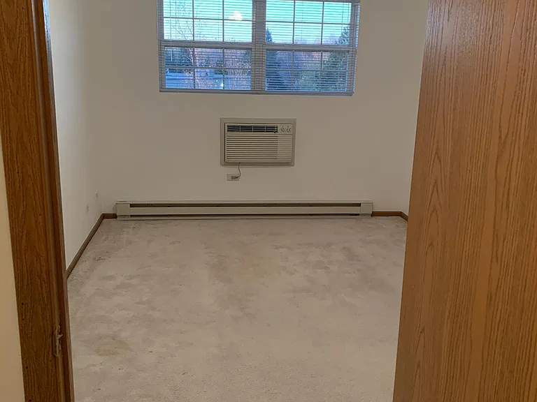Spacious bedroom with ceiling fan
