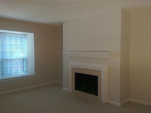 Living Room with fireplace and bay window