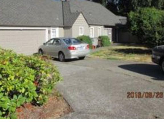 Double car garage and storage shed