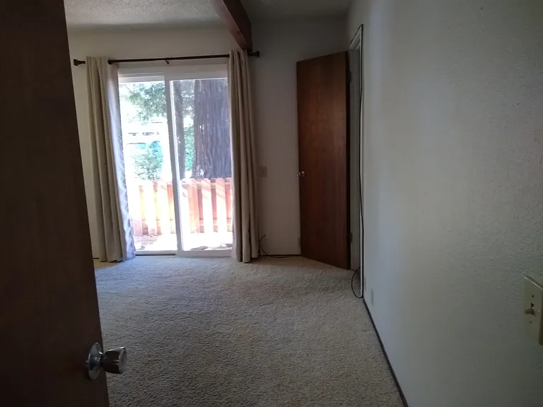 Primary bedroom as viewed from hallway door.