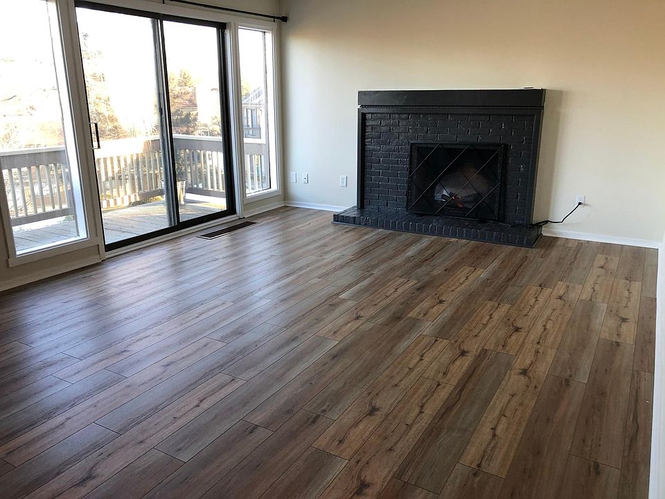 Living Room, focal point fireplace with warming electric flames, slider to sunny deck.