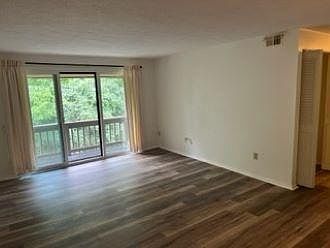 Main living room view to the left as soon as you walk in, access to deck