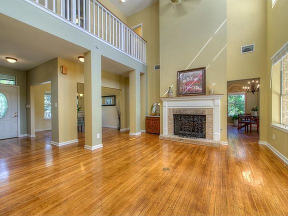 living area. 2-way fireplace. hardwood floors. 