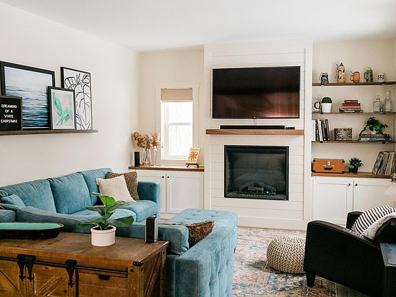 Living room with electric fireplace.