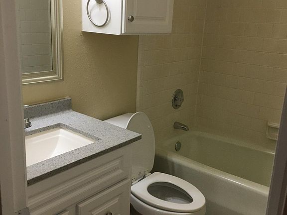 806 bath has brown cabinets