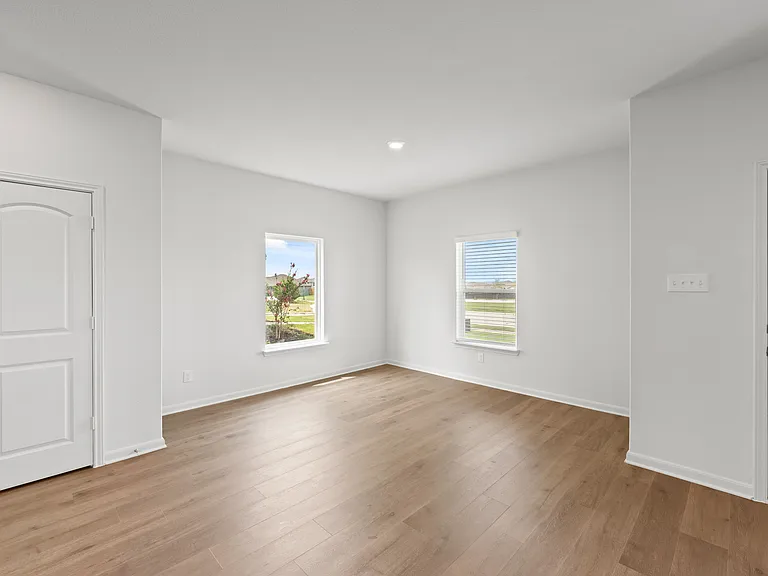 The dining room sits right off of the kitchen and has a large window.
