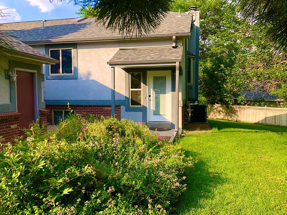 End unit with flower garden out front