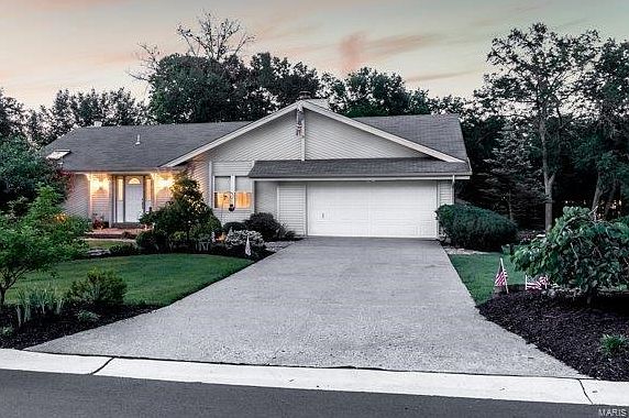 FRONT ELEVATION OF 6 BURGUNDY AT TWILIGHT...