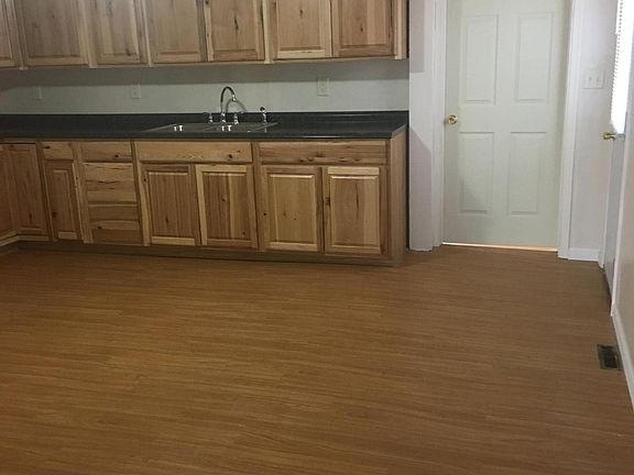 Kitchen with door to downstairs bedroom