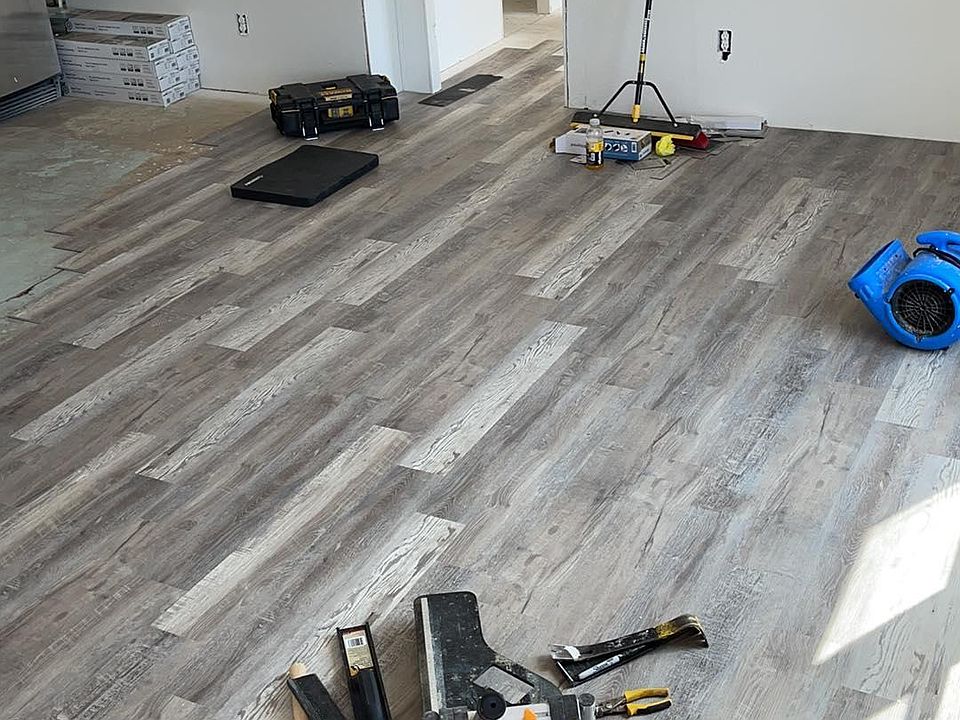 new laminate flooring being installed in every room