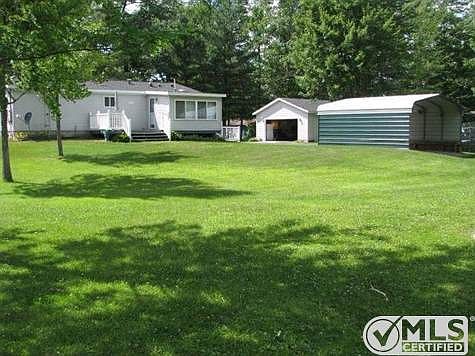 Home, Carport, and Detached 2 car Garage