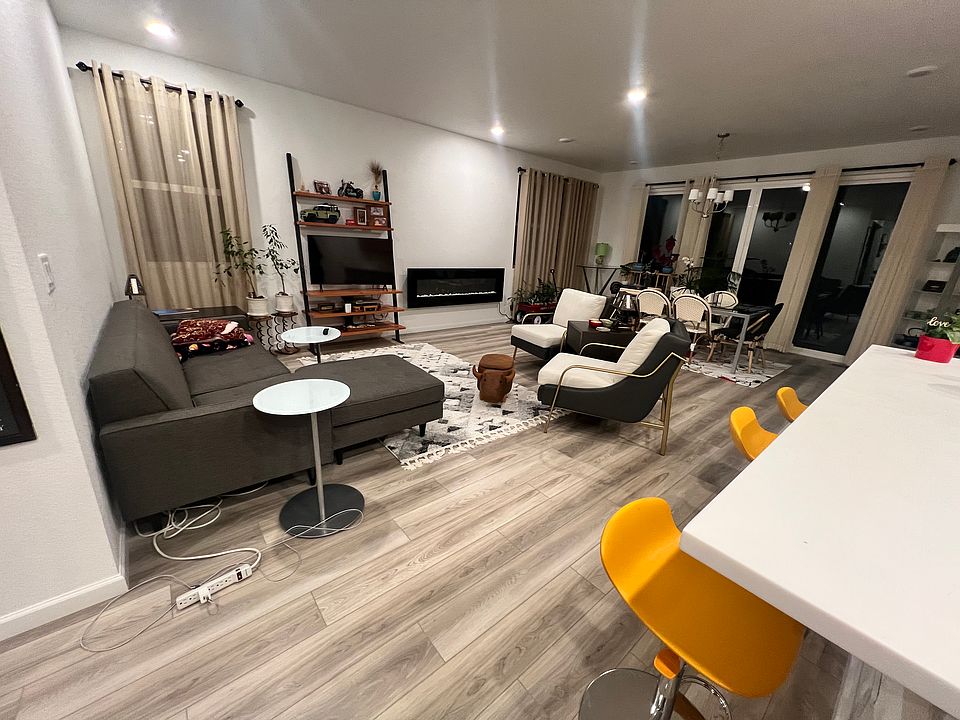 Living room with a large glass patio door to backyard.