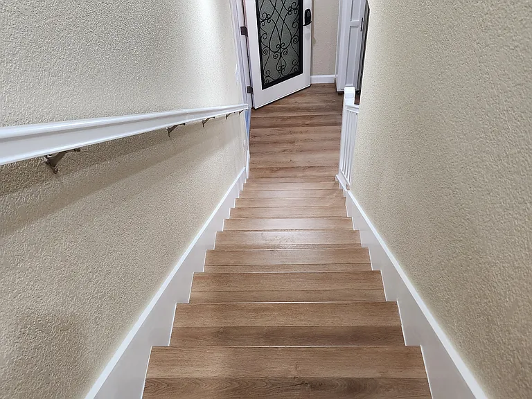 View of front door from stairwell.