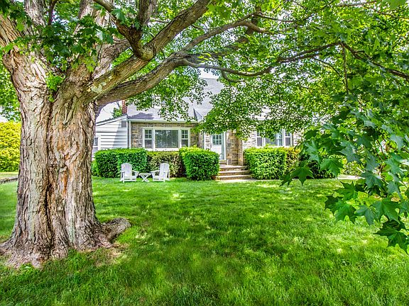 Magical maple tree in your oversized front yard gives privacy and shade to keep cool on hot summer day.