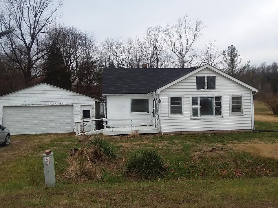 Front view of house and garage from road