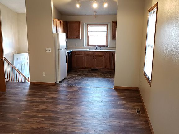 Front door, kitchen, and dining