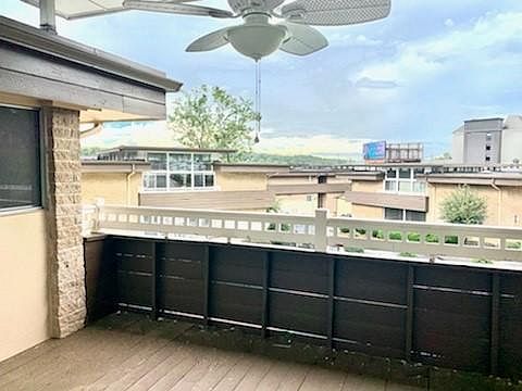 Through a wall of floor-to-ceiling glass, a wide french door opens onto the spacious light-filled balcony with stunning views of spectacular sunsets!