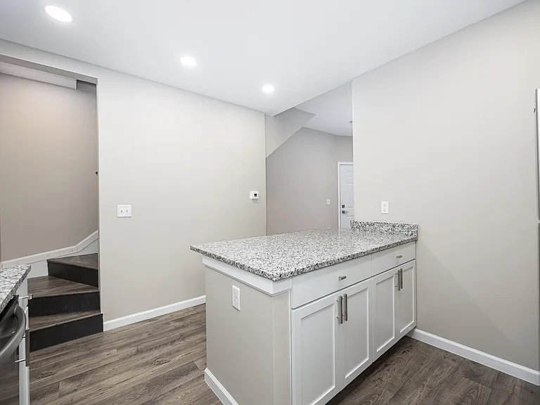 Kitchen / Stairs to 2nd floor