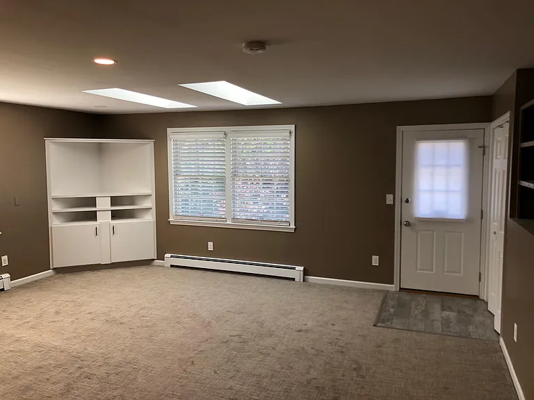 Living area and door that access shared deck