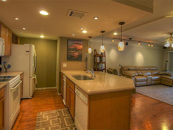 Kitchen with large quartz counter space.