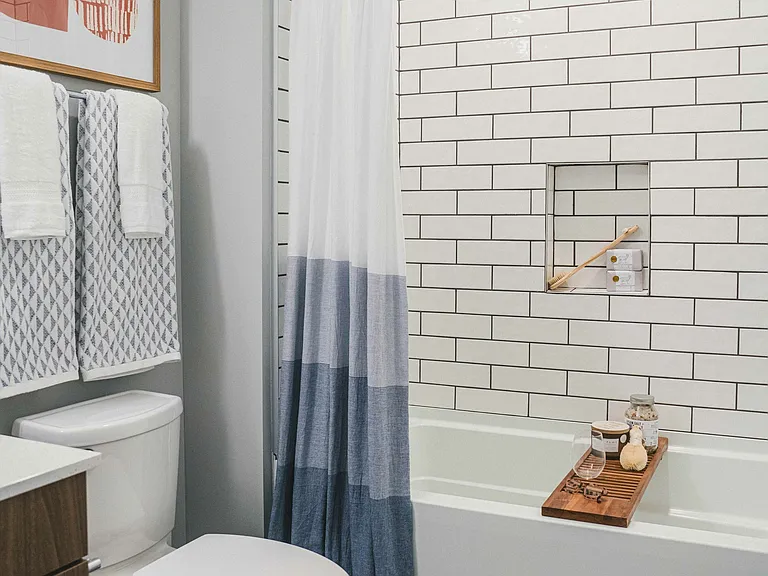 Escape to tranquility in our apartments with a luxurious bathroom, featuring a relaxing tub.