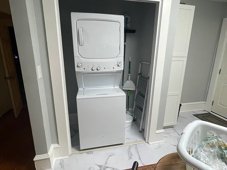 Laundry closet with stack washer and dryer