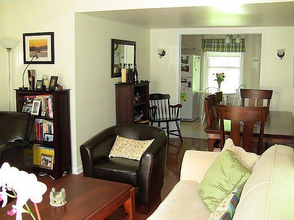 View of living room, dining room, and kitchen nook.