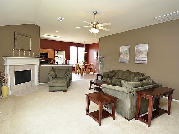 Entry to the home is a spacious family room open to the kitchen.