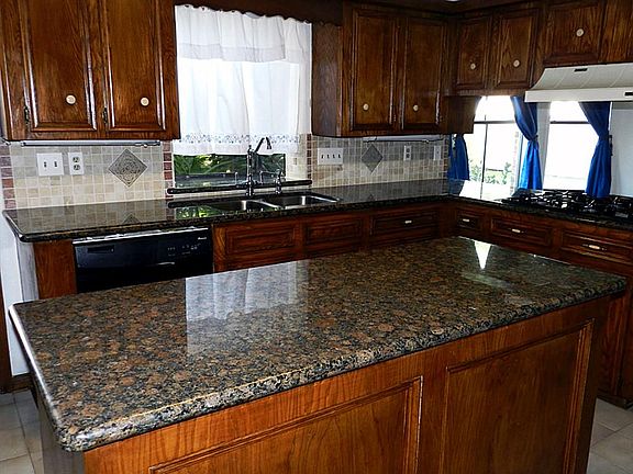 Kitchen: Beautiful new paint, granite counter tops, back splash, stainless deep double sinks, and fa